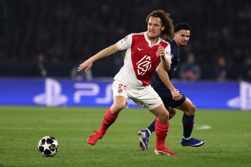 Monaco's Belgian defender #25 Wout Faes (L) and Paris Saint-Germain's French midfielder #33 Warren Zaire-Emery (R) fight for the ball during the UEFA Champions League play-off second leg football match between Paris Saint-Germain (PSG) and AS Monaco at the Parc des Princes stadium in Paris on February 25, 2026.  FRANCK FIFE / AFP