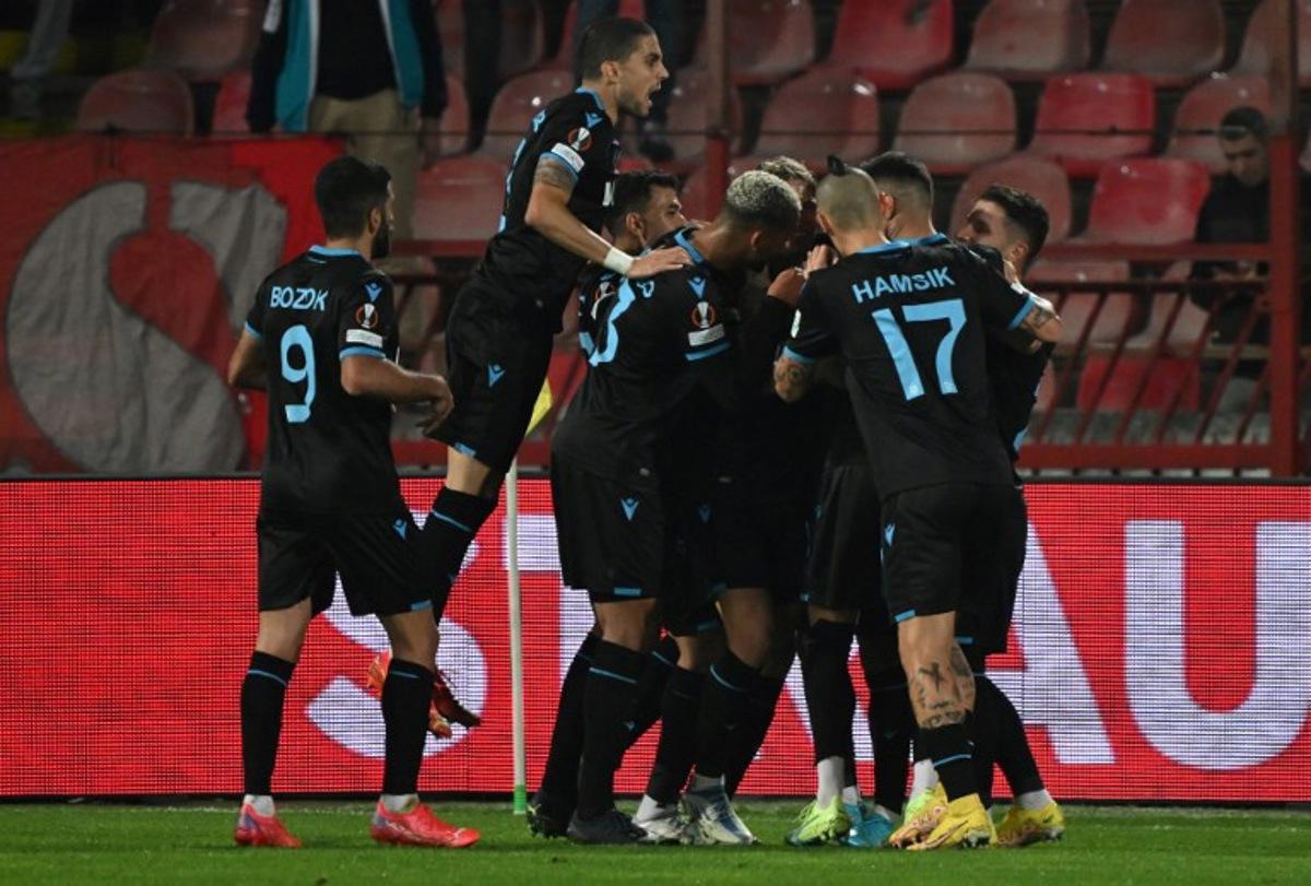 Trabzonspor's players celebrate after scoring their team's first goal during the Group H  UEFA Europa League football match between Crvena Zvezda Beograd (SRB) and Trabzonspor (TUR) at The Rajko Mitic Stadium in Belgrade, on October 27, 2022.   ANDREJ ISAKOVIC / AFP