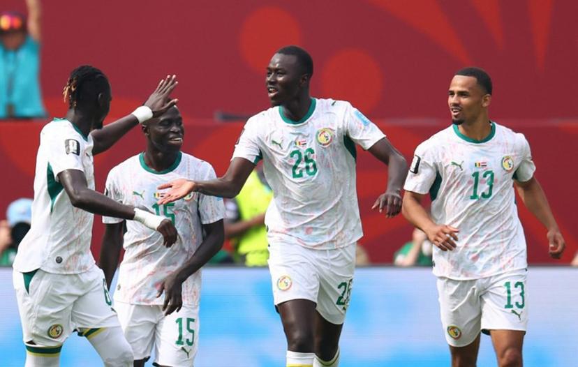 Senegal's midfielder #26 Pape Gueye celebrates with teammates after scoring his team's fouth goal during the 2026 World Cup Group I football match between Senegal and Iraq at the Toronto Stadium in Toronto on June 26, 2026.   Cole Burston / AFP