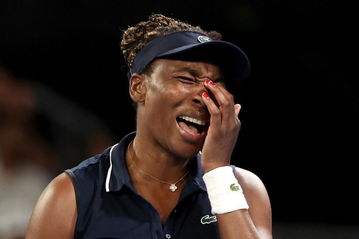 USA's Venus Williams reacts on a point to Serbia's Olga Danilovic during their women's singles match on day one of the Australian Open tennis tournament in Melbourne on January 18, 2026.  Martin KEEP / AFP