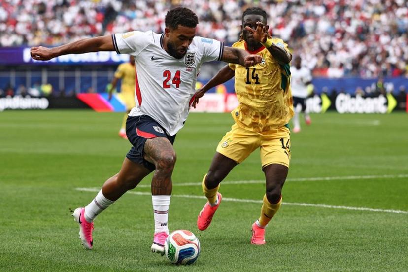 England's defender #24 Reece James (L) fights for the ball with Ghana's defender #14 Gideon Mensah  during the 2026 World Cup Group L football match between England and Ghana at the Boston Stadium in Foxborough on June 23, 2026.   CHARLY TRIBALLEAU / AFP