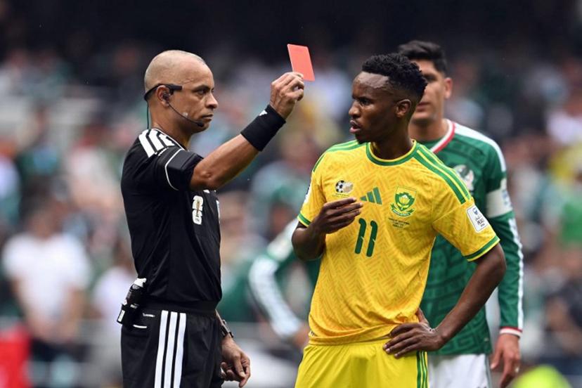 Brazilian referee Wilton Sampaio shows a red card to South Africa's midfielder #11 Themba Zwane during the 2026 World Cup Group A football match between Mexico and South Africa at the Mexico City Stadium in Mexico City on June 11, 2026.  Yuri CORTEZ / AFP