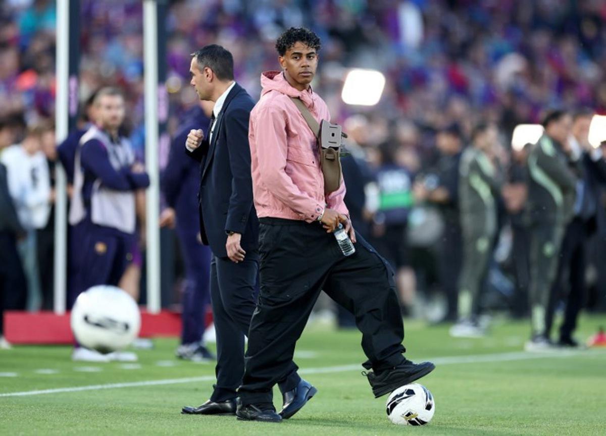 Barcelona's Spanish forward #10 Lamine Yamal stands on the side of the pitch prior the Spanish league football match between FC Barcelona and Real Madrid CF at Camp Nou Stadium in Barcelona on May 10, 2026.  Josep LAGO / AFP