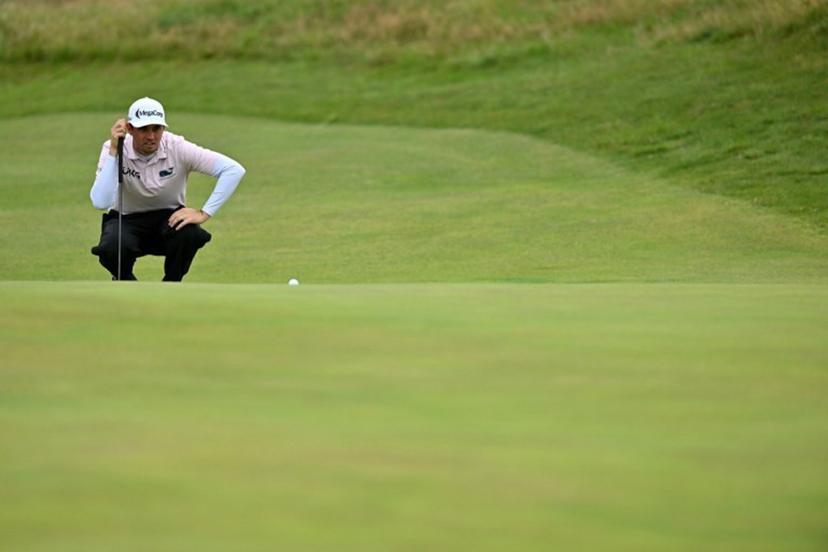 US golfer JT Poston lines up a putt on the 14th green on day three of the 151st British Open Golf Championship at Royal Liverpool Golf Course in Hoylake, north west England on July 22, 2023.                                                                                                                The 151st Open at The Royal Liverpool Golf Course is set to run until July 23. Glyn KIRK / AFP