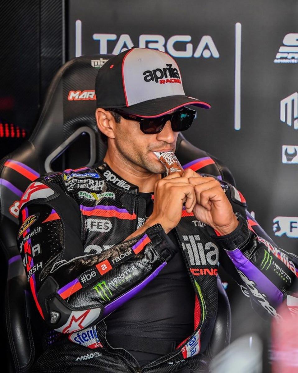 Team Aprilia Racing's Jorge Martin eats prior to the Practice session at the Balaton Park Circuit in Balatonfokajar, Hungary, on June 5, 2026, ahead of the Hungarian Motorcycle MotoGP Grand Prix.   FERENC ISZA / AFP