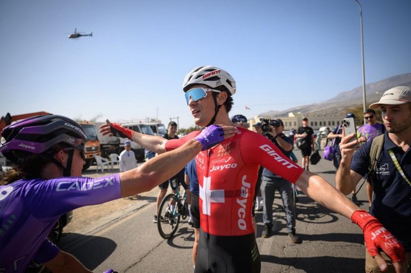 Team Jayco AlUla Swiss rider Mauro Schmid celebrates after winning the 3d stage of the Tour of Oman cycling race from Samail "Al Fayhaa Resthouse" to Misfat Al Abriyeen, on February 9, 2026.  Loic VENANCE / AFP