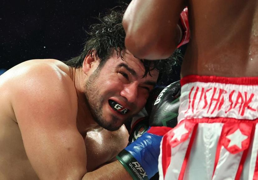 Mexican boxer Gilberto Ramírez (L) faces off against Cuban boxer Yuniel Dorticos during their WBA/WBO unified cruiserweight championship bout at the Honda Center in Anaheim, California, on June 28, 2025.  Patrick T. Fallon / AFP