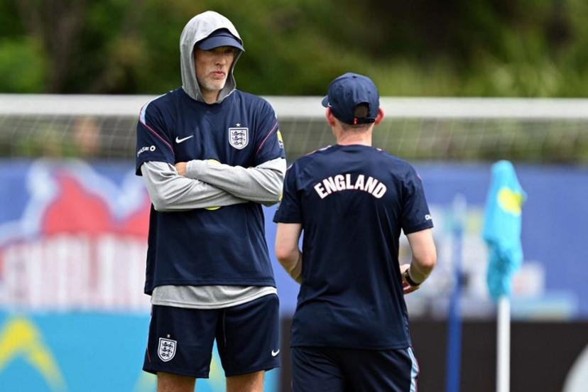 England's German head coach Thomas Tuchel speaks with his assistant during a training session as part of the team's preparation for its FIFA World Cup football tournament opening match against Croatia at the team's training camp in Palm Beach Gardens on June 9, 2026.  CHANDAN KHANNA / AFP