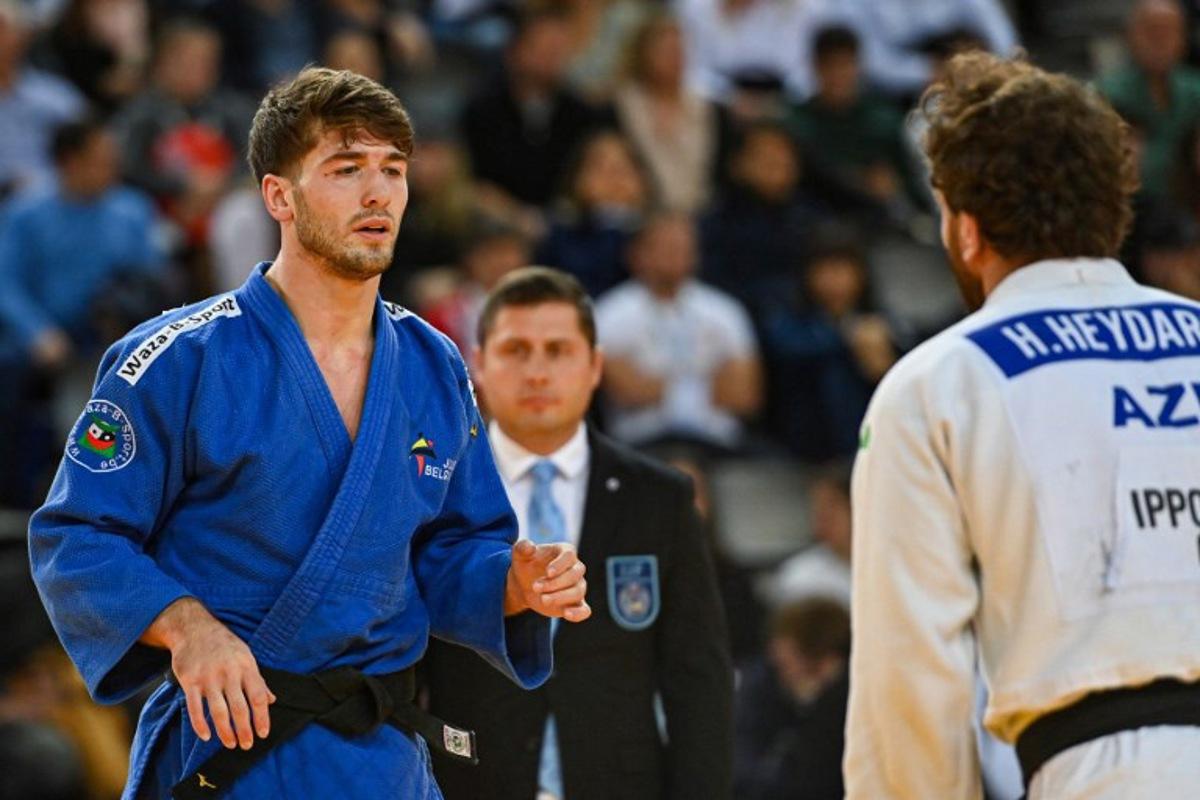 Belgium's Abdul Malik Umayev (white) and Azerbaijan's Hidayat Heydarov (blue) compete in the men's under 73 kg qualifying round during the European Judo Championships 2023 at the Sud de France Arena in Montpellier, southern France, on November 4, 2023.  Sylvain THOMAS / AFP