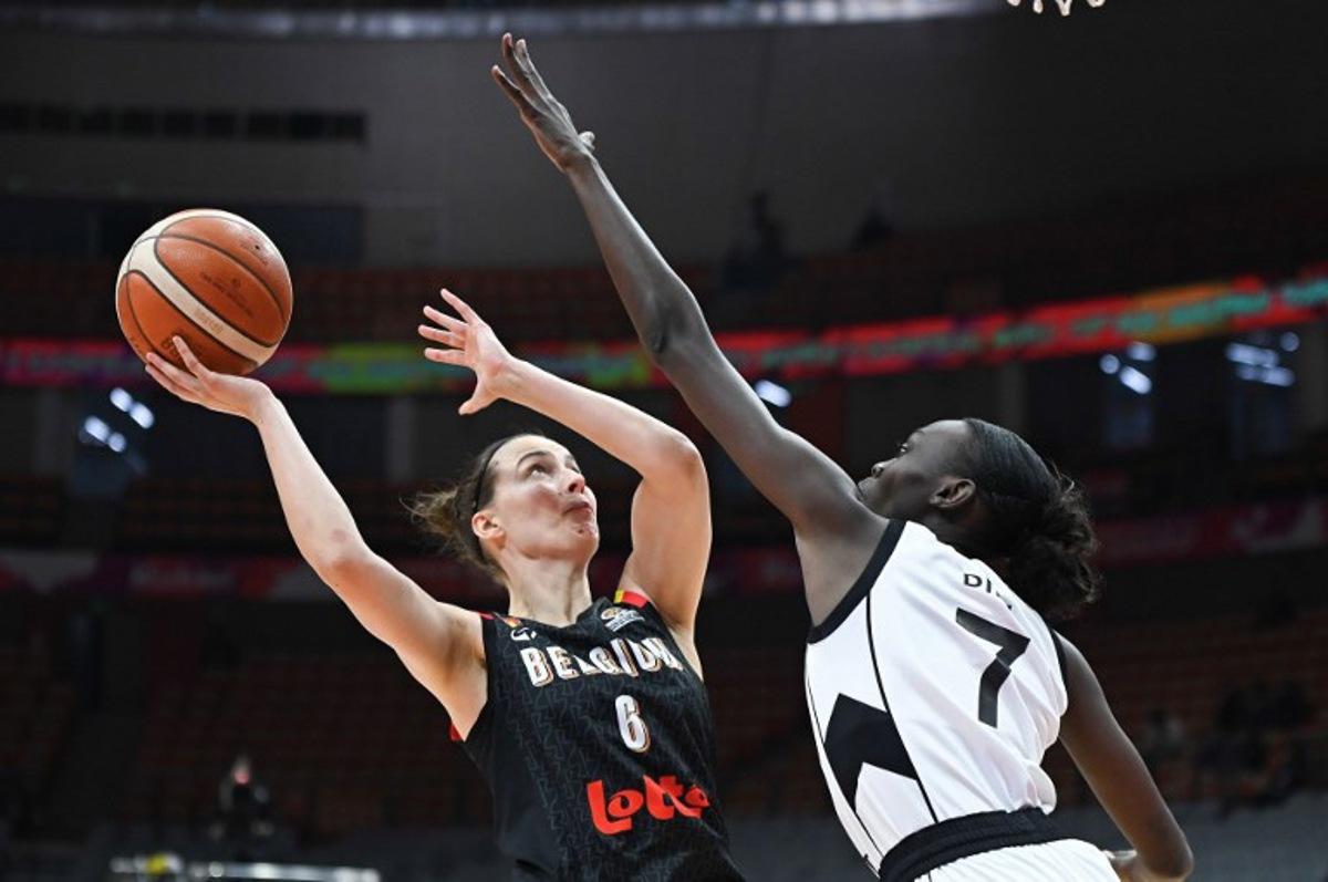 Belgium's Antonia Delaere (L) is blocked by South Sudan's Nyamer Diew during the FIBA Women's Basketball World Cup 2026 qualifying tournament game between Belgium and South Sudan in Wuhan, in China's central Hubei province, on March 15, 2026.  CN-STR / AFP
