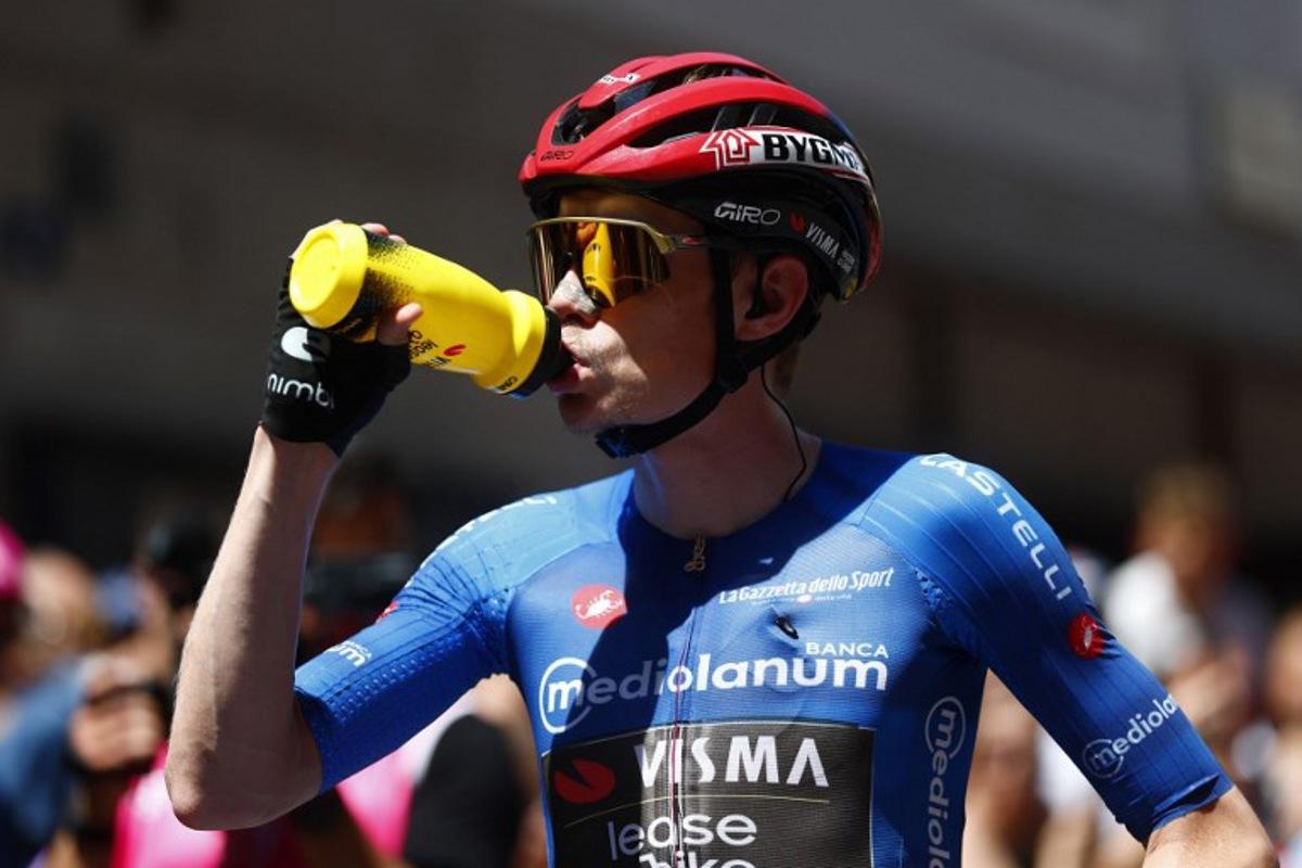 Team Visma Lease a Bike Danish rider Jonas Vingegaard drinks before the start of the 14th stage of the Giro d'Italia 2026 - Tour of Italy cycling race between Aosta and Pila (Gressan), Italy, on May 23, 2026.  Luca Bettini / AFP