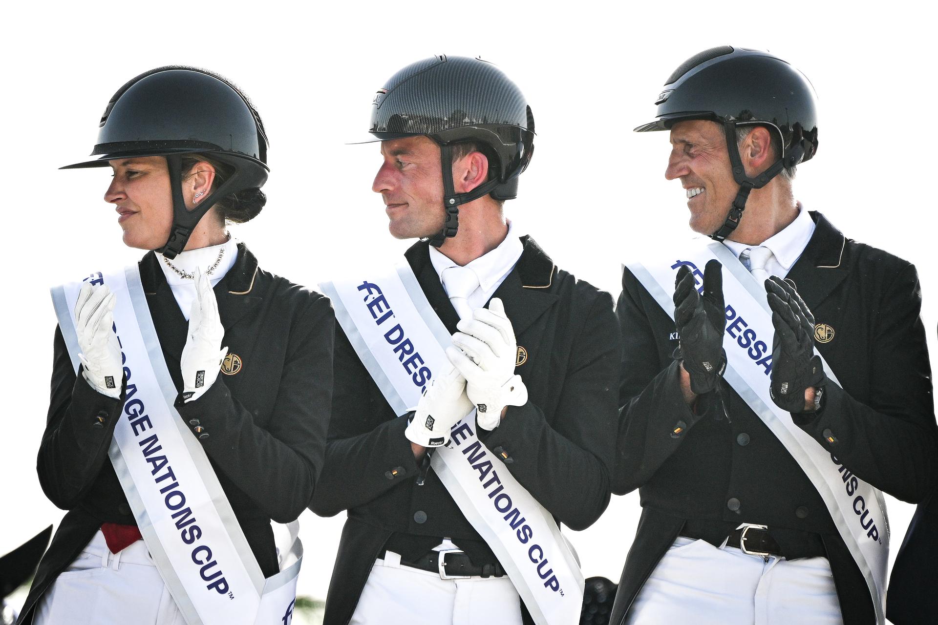 Belgian Larissa Pauluis, Belgian Justin Verboomen and Belgian Wim Verwimp pictured during the podium ceremony after the Dressage Nations Cup FEI CDIO4 equestrian event in Koningshooikt, Lier on Saturday 23 May 2026. BELGA PHOTO ELIAS ROM