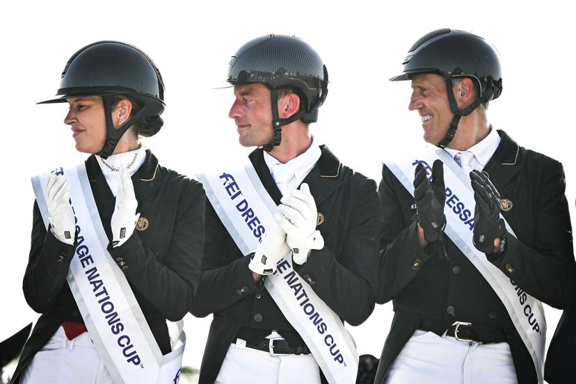 Belgian Larissa Pauluis, Belgian Justin Verboomen and Belgian Wim Verwimp pictured during the podium ceremony after the Dressage Nations Cup FEI CDIO4 equestrian event in Koningshooikt, Lier on Saturday 23 May 2026. BELGA PHOTO ELIAS ROM