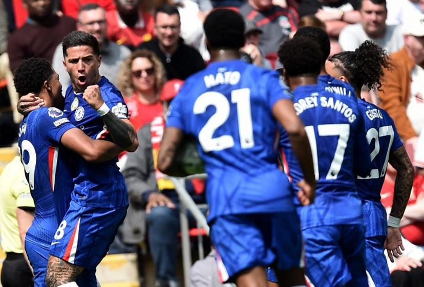 Chelsea's Argentinian midfielder #08 Enzo Fernandez (2L) celebrates with Chelsea's French defender #29 Wesley Fofana after scoring the equalising goal during the English Premier League football match between Liverpool and Chelsea at Anfield in Liverpool, north west England on May 9, 2026.  PETER POWELL / AFP