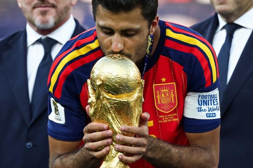 Spain's midfielder #16 Rodri kisses the trophy after winning the 2026 World Cup football tournament final match between Spain and Argentina at the New York/New Jersey Stadium in East Rutherford on July 19, 2026.   FRANCK FIFE / AFP