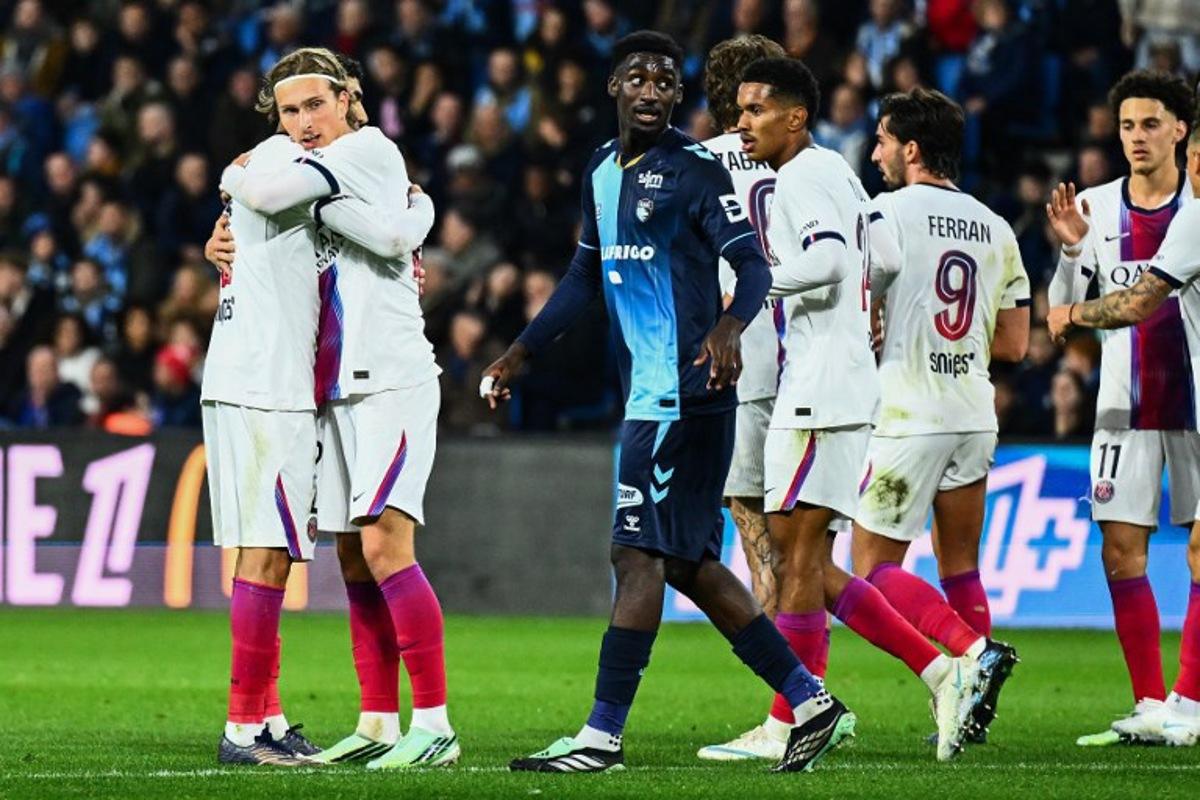 PSG's Belgian forward #22 Mika Godts (2L) celebrates scoring his team's first goal during the French L1 football match between Le Havre Athletic Club and Paris Saint-Germain (PSG) at Stade Oceane in Le Havre, north-western France on October 30, 2026.  Guillaume SALIGOT / AFP