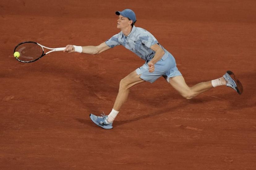 Italy's Jannik Sinner plays a forehand return to France's Clement Tabur during their men's singles match on day 3 of the French Open tennis tournament on Court Philippe-Chatrier at the Roland-Garros Complex in Paris on May 26, 2026.  Dimitar DILKOFF / AFP