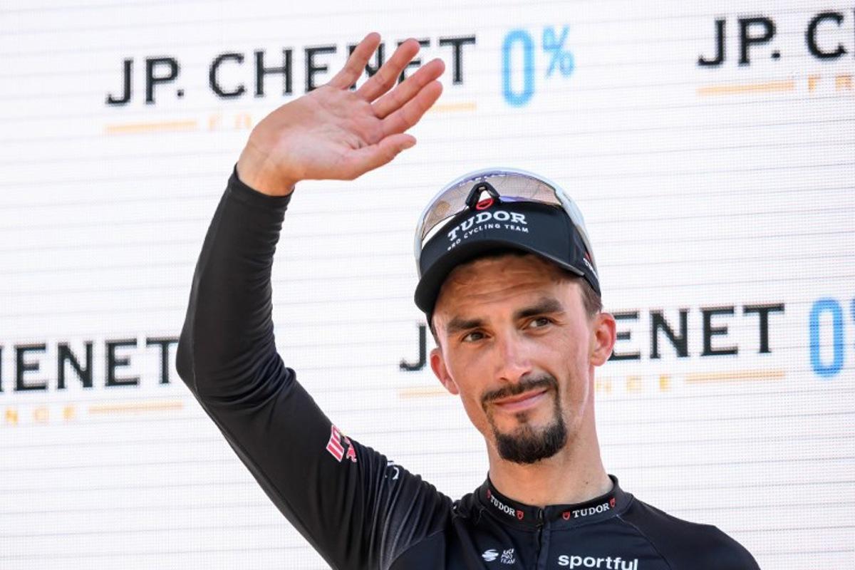 Tudor Pro Cycling Team's French rider Julian Alaphilippe, awarded as best fighter of the stage, gestures during the podium ceremony of the second stage 157,7 km from Locarno to Locarno at the Men's Tour of Switzerland (Tour de Suisse) cycling race in Locarno, Switzerland, on June 18, 2026.  Fabrice COFFRINI / AFP
