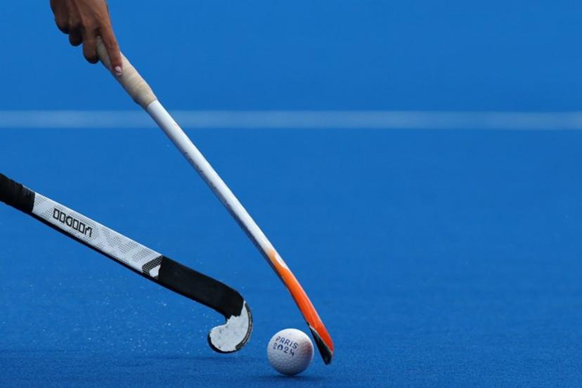 Players fight for the ball in the women's pool A field hockey match between the Netherlands and Japan during the Paris 2024 Olympic Games at the Yves-du-Manoir Stadium in Colombes on August 3, 2024.  Ahmad GHARABLI / AFP