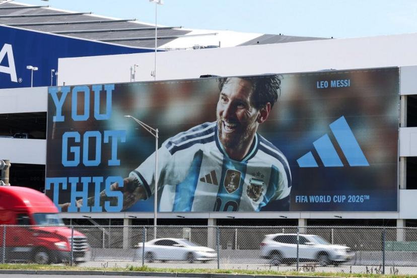 Vehicles pass by a parking garage with a billboard featuring Argentina's Lionel Messi, next to the New York New Jersey Stadium (temporarily renamed from MetLife Stadium) ahead of the 2026 FIFA World Cup in East Rutherford, New Jersey, on June 9, 2026.  TIMOTHY A. CLARY / AFP