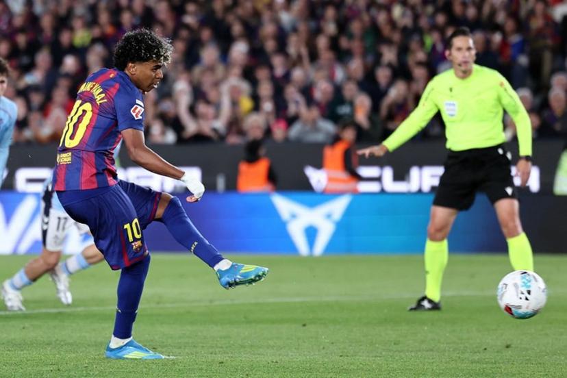 Barcelona's Spanish forward #10 Lamine Yamal scores the opening goal from the penalty spot during the Spanish league football match between FC Barcelona and RC Celta de Vigo at Camp Nou stadium in Barcelona on April 22 , 2026.  Josep LAGO / AFP