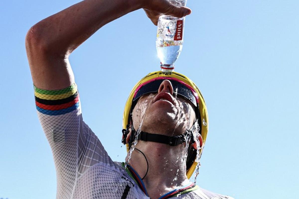 UAE Team Emirates - XRG's Slovenian rider Tadej Pogacar douses himself with water as he celebrates after winning the 3rd stage of the 113th edition of the Tour de France cycling race, 196 km between Granollers and Les Angles in southern France, on July 6, 2026.  Anne-Christine POUJOULAT / POOL / AFP