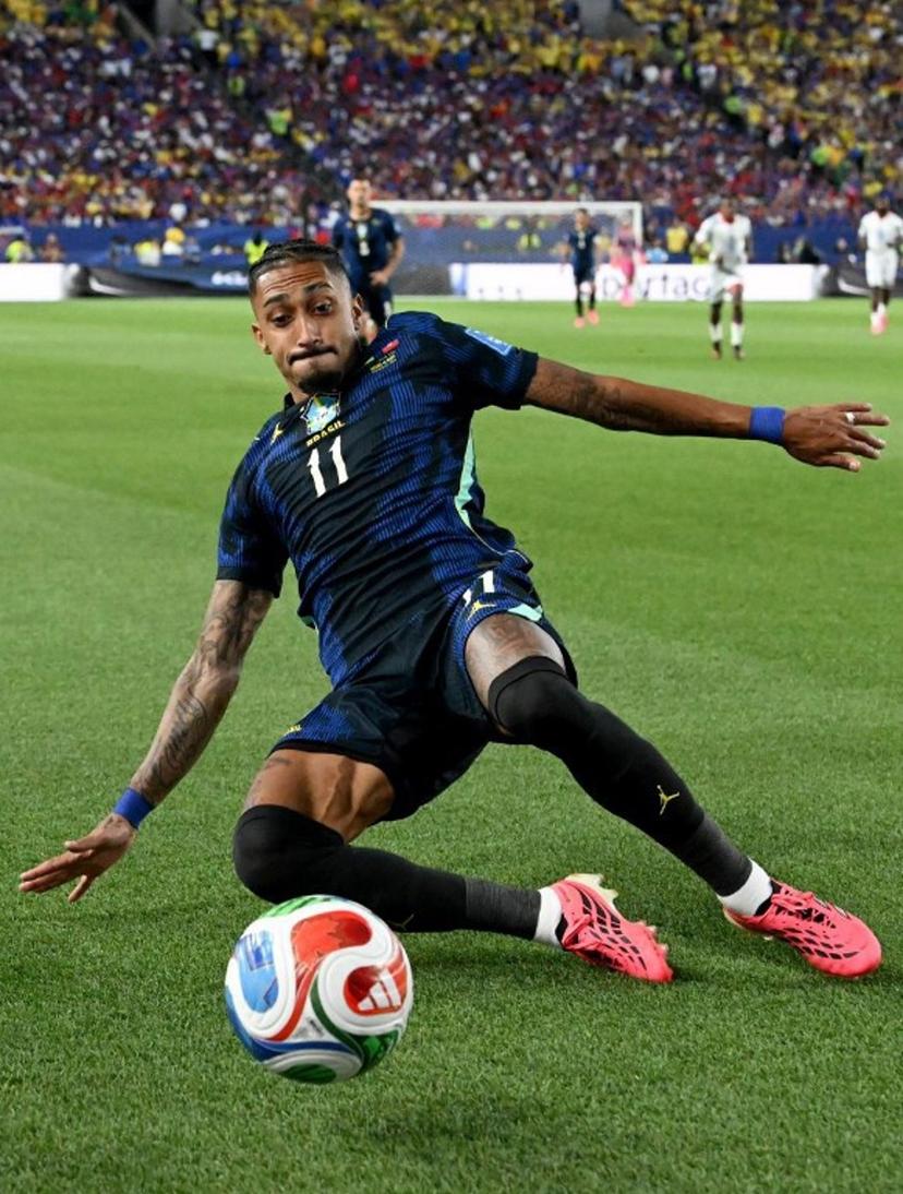 Brazil's forward #11 Raphinha slides for the ball during the 2026 World Cup Group C football match between Brazil and Haiti at the Philadelphia Stadium in Philadelphia on June 19, 2026.   ROBERTO SCHMIDT / AFP