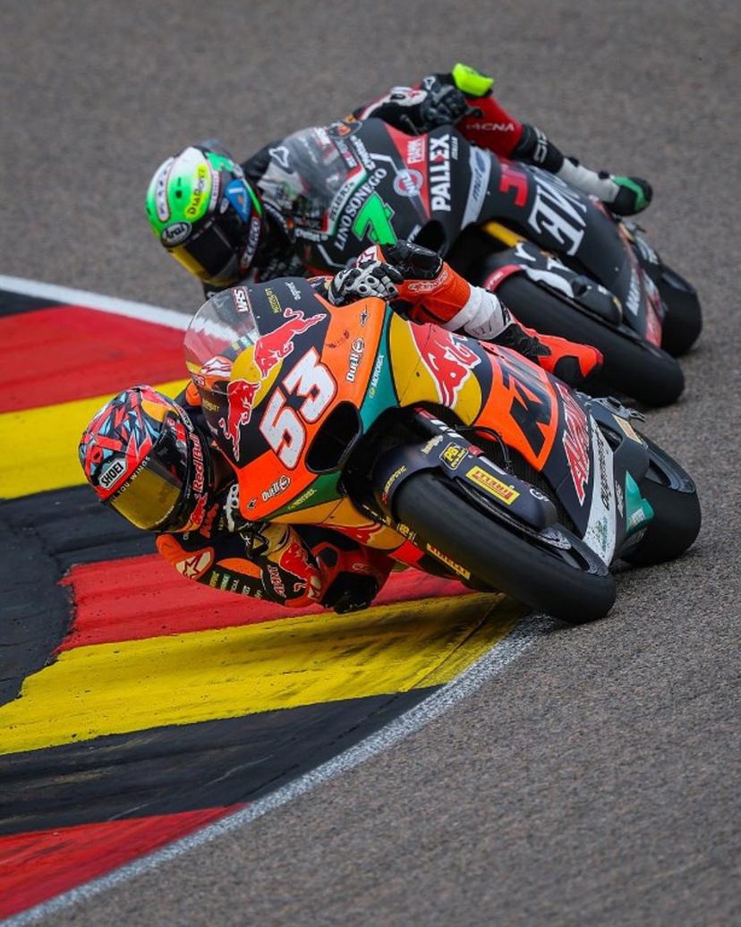 Red Bull KTM Ajo Team's Turkish Moto2 rider Deniz Oncu (front) leads next to Fantic Racing Team's Belgiums Moto2 rider Barry Baltus during the German Moto2 Grand Prix at the Sachsenring racing circuit, in Hohenstein-Ernstthal near Chemnitz, eastern Germany on July 13, 2025.  Ronny Hartmann / AFP