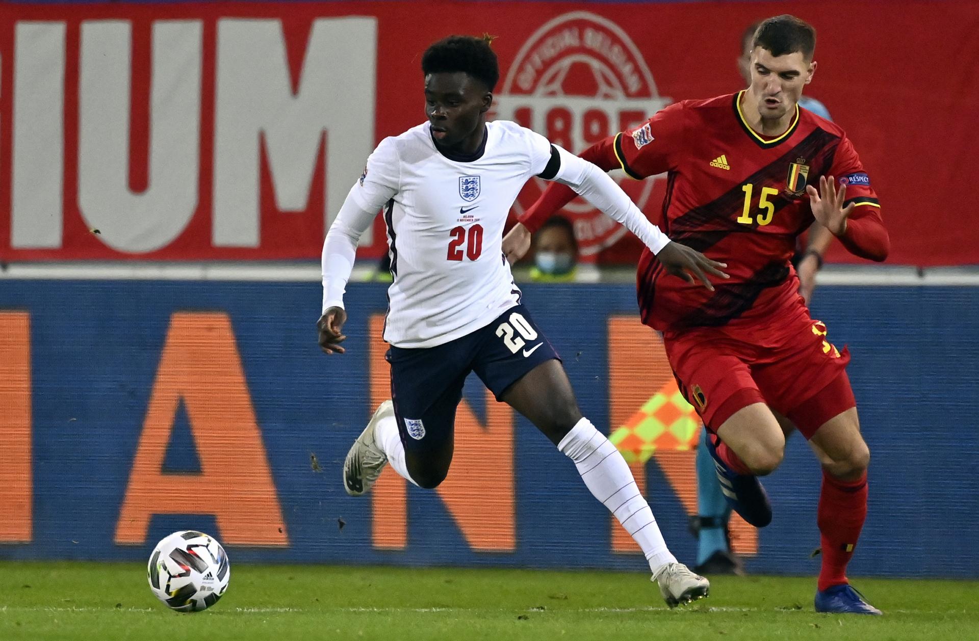 England's midfielder Bukayo Saka and Belgium's Thomas Meunier fight for the ball during a Nations League soccer game between the Belgian national team Red Devils and England, the fifth game (out of six) in the League A, Group 2, Sunday 15 November 2020 in Leuven. BELGA PHOTO DIRK WAEM
