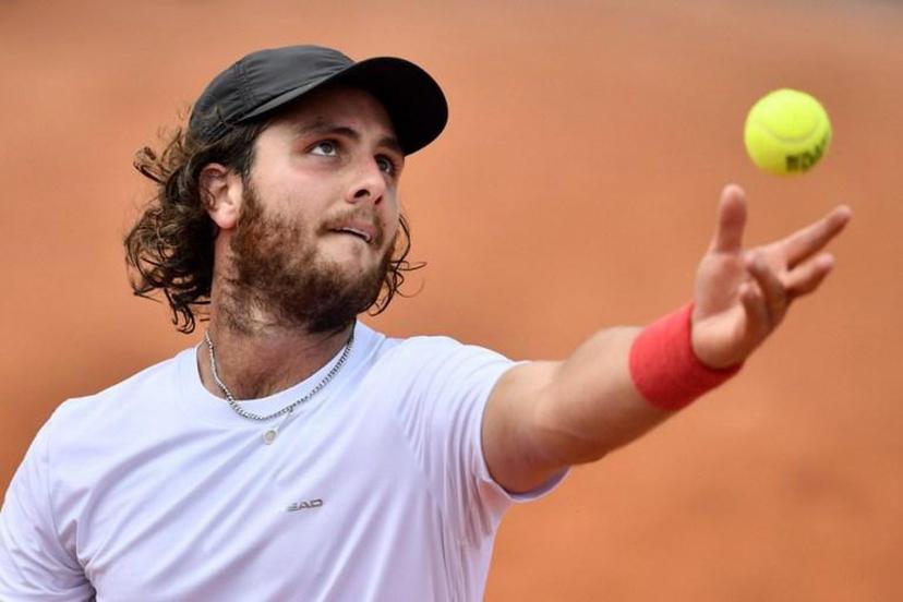 Argentina's Marco Trungelliti serves to Australia's Bernard Tomic during their men's singles first round match on day two of The Roland Garros 2018 French Open tennis tournament in Paris on May 28, 2018. Argentinian Marco Trungelliti embarked on a road trip from Barcelona to Paris and was rewarded with a lucky loser spot to play Bernard Tomic at Roland Garros. The world number 190 had already returned to his base in Barcelona after losing in qualifying last week, but a spate of withdrawals saw a possible place in the main draw open up.  CHRISTOPHE SIMON / AFP