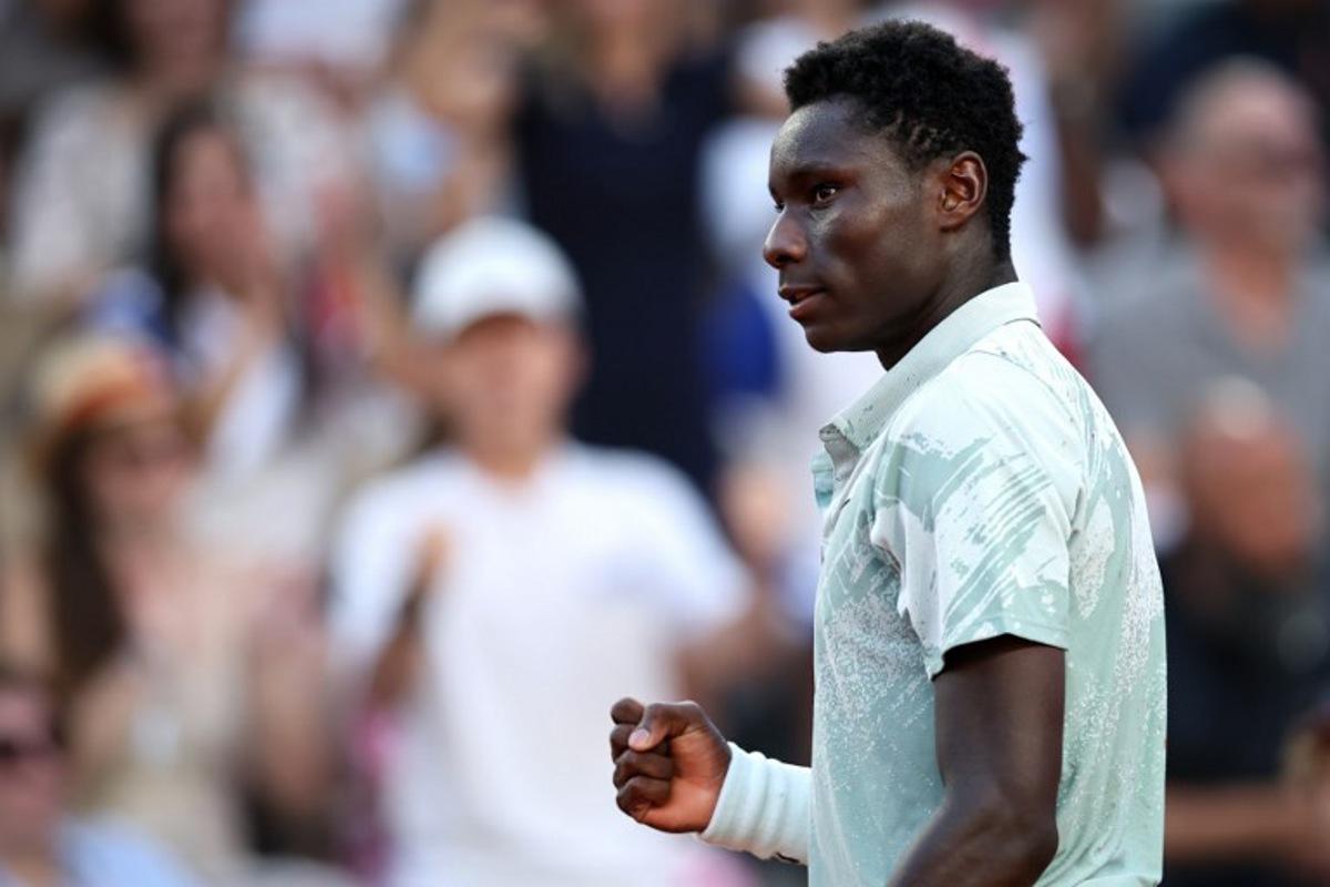 France's Moise Kouame reacts to a point against Chile's Alejandro Tabilo during their men's singles match on day 7 of the French Open tennis tournament on Court Suzanne-Lenglen at the Roland-Garros Complex in Paris on May 30, 2026.  Anne-Christine POUJOULAT / AFP