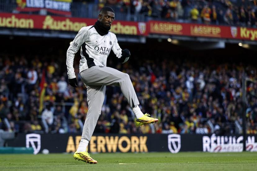 PSG's French forward #10 Ousmane Dembele takes part in the warm-up ahead of the French L1 football match between RC Lens and Paris Saint-Germain (PSG) at the Stade Bollaert-Delelis stadium in Lens on May 13, 2026.  SIMON WOHLFAHRT / AFP