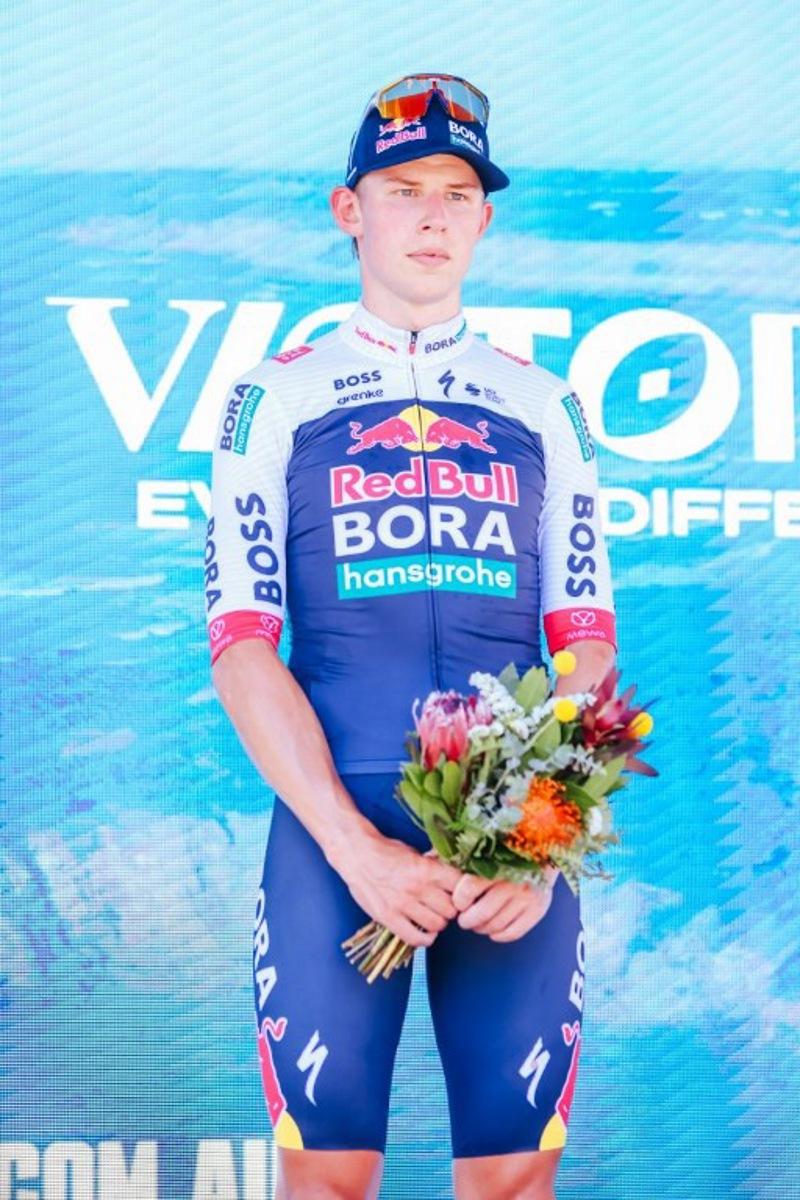 Third-placed New Zealand's Laurence Pithie of Team Red Bull-BORA-Hansgrohe stands on the podium after the men's elite cycling event of the 2025 Cadel Evans Great Ocean Road Race in Geelong on February 2, 2025.  CHRIS PUTNAM / AFP