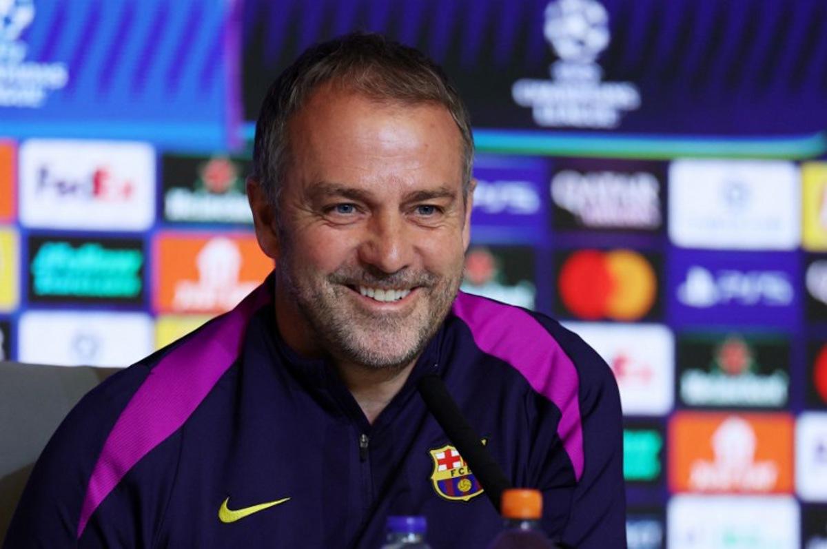 Barcelona's German coach Hans-Dieter Flick gives a press conference on the eve of their UEFA Champions League quarter final second leg football match against Club Atletico de Madrid at Metropolitano Stadium in Madrid, on April 13, 2026.  Thomas COEX / AFP