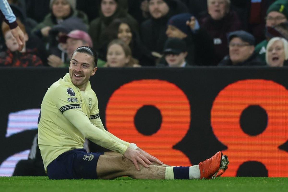 Everton's English midfielder #18 Jack Grealish reacts after being fouled during the English Premier League football match between Aston Villa and Everton at Villa Park in Birmingham, central England on January 18, 2026.  Darren Staples / AFP