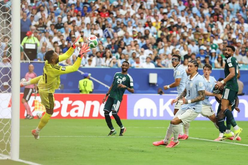 Saudi Arabia's goalkeeper #21 Mohammed Al-Owais catches the ball during the 2026 World Cup Group H football match between Saudi Arabia and Uruguay at the Miami Stadium in Miami Gardens on June 15, 2026.   PATRICIA DE MELO MOREIRA / AFP