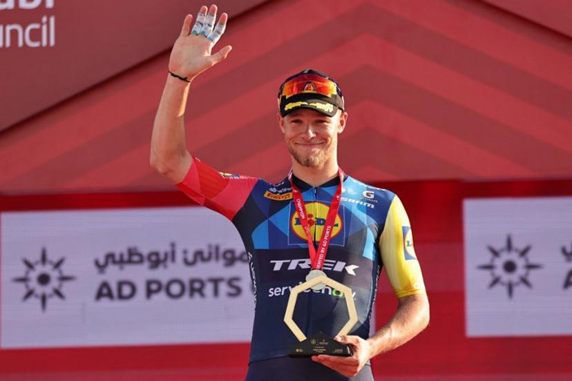 Lidl-Trek's Italian rider Jonathan Milan celebrates on the podium after finishing first in the seventh and final stage of the UAE Tour cycling event from Zayed National Museum to Abu Dhabi Breakwater in Abu Dhabi on February 22, 2026.  Fadel SENNA / AFP