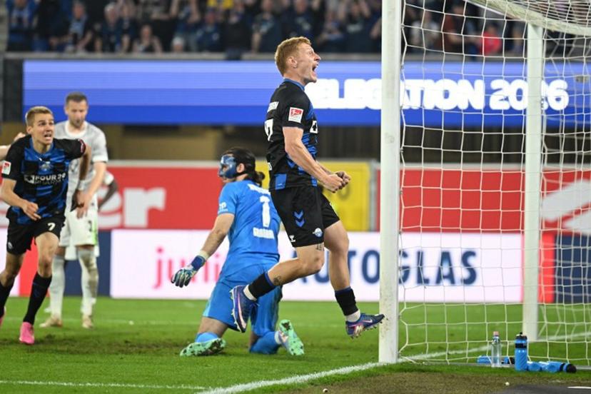SC Paderborn's German defender #17 Laurin Curda celebrates his 2-1 during the German Bundesliga relegation second-leg football match between SC Paderborn 07 and VfL Wolfsburg in Heidenheim on May 22, 2025.  Ina FASSBENDER / AFP