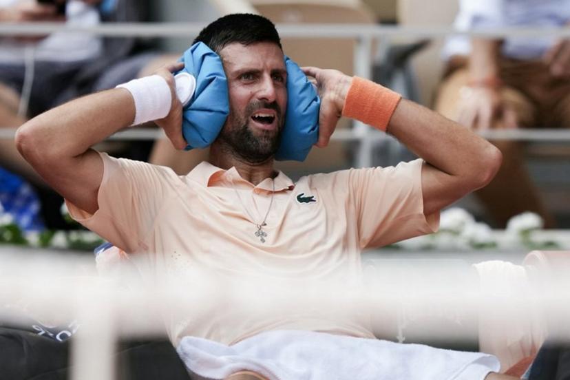 Serbia's Novak Djokovic reacts while sitting in between games as he plays against Brazil's Joao Fonseca during their men's singles match on day 6 of the French Open tennis tournament on Court Philippe-Chatrier at the Roland-Garros Complex in Paris on May 29, 2026.  Dimitar DILKOFF / AFP