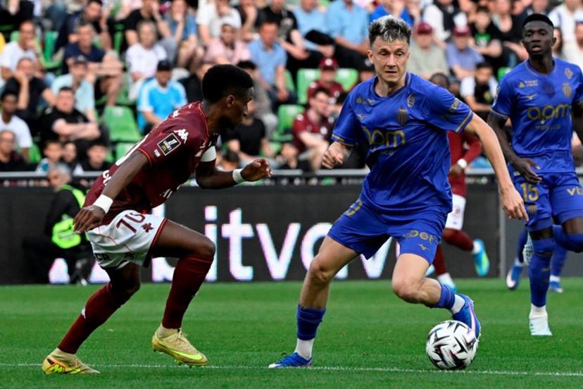 Metz's Senegalese defender #70 Bouna Sarr (L) fights for the ball with Monaco's Russian midfielder #10 Aleksandr Golovin during the French L1 football match between FC Metz and AS Monaco at the Stade Saint-Symphorien in Longeville-les-Metz, eastern France on May 2, 2026.  Jean-Christophe VERHAEGEN / AFP