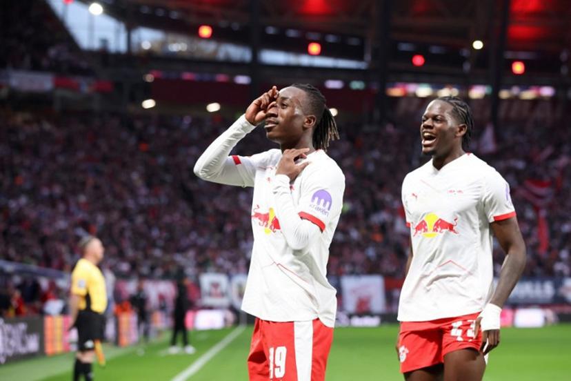 Leipzig's Ivorian forward #49 Yan Diomande (L) and Leipzig's French defender #23 Castello Lukeba celebrate the team's first goal after Stuttgart's German defender #24 Jeff Chabot scored an own goal during the German first division Bundesliga football match between RB Leipzig and VfB Stuttgart in Leipzig, eastern Germany on November 1, 2025.  Ronny HARTMANN / AFP