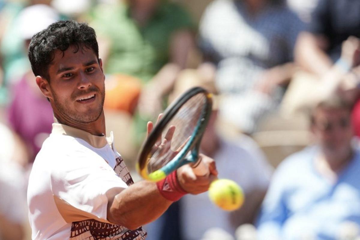 Paraguay's Adolfo Daniel Vallejo plays a forehand return to France's Moise Kouame during their men's singles match on day 5 of the French Open tennis tournament on Court Suzanne-Lenglen at the Roland-Garros Complex in Paris on May 28, 2026.  Dimitar DILKOFF / AFP