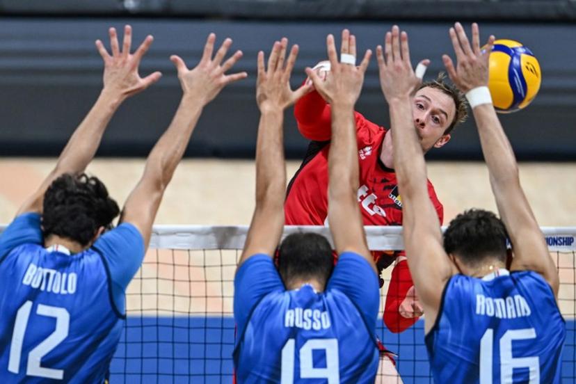 Belgium's Ferre Reggers spikes the ball during the 2025 Men's Volleyball World Championship quarter-final match between Belgium and Italy at the Mall of Asia Arena in Pasay City, Metro Manila, on September 24, 2025.  Jam STA ROSA / AFP
