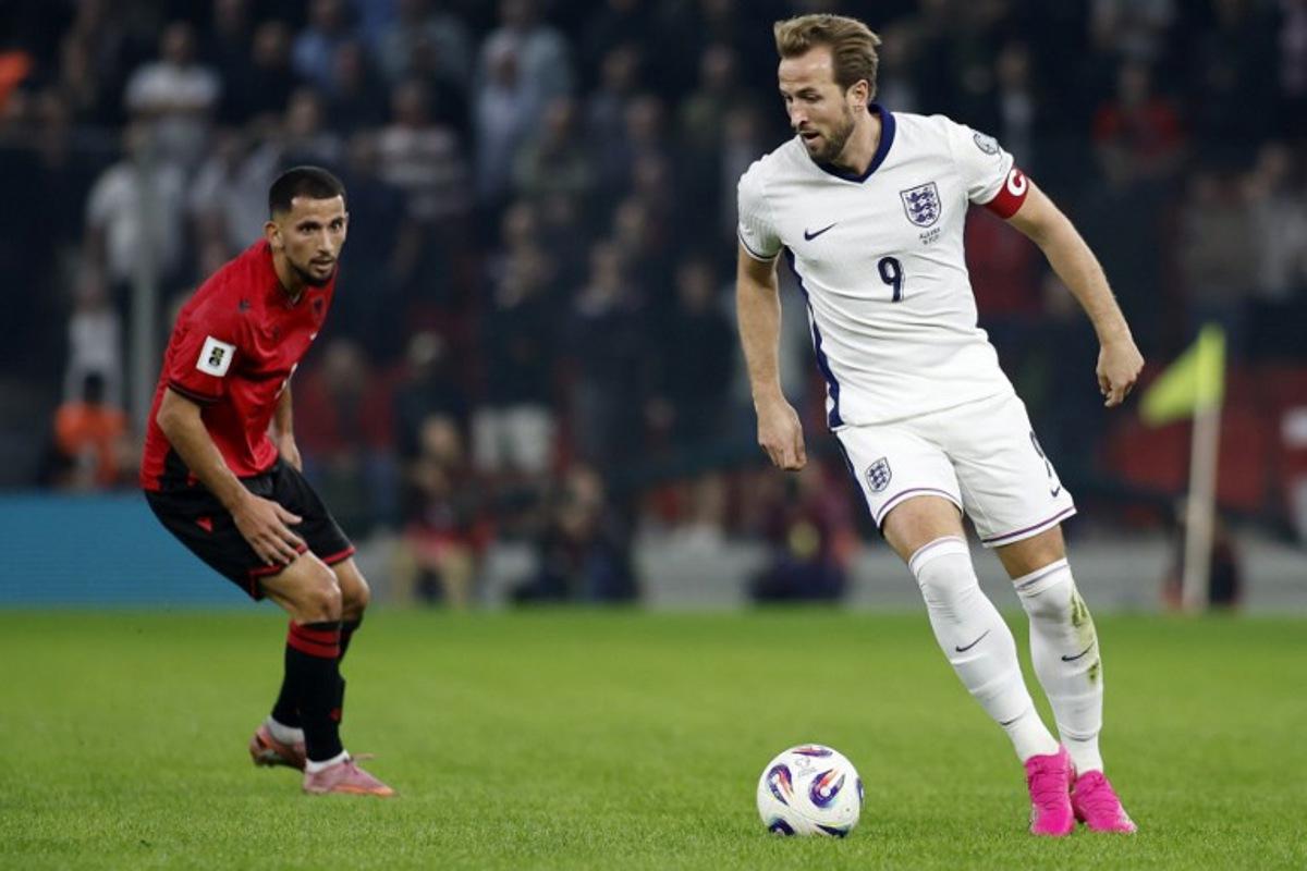 England's striker #09 Harry Kane controls the ball in front of Albania's defender #17 Naser Aliji during the FIFA World Cup 2026 European qualification football match between Albania and England at the Air Albania stadium in Tirana, on November 16, 2025.   Adnan Beci / AFP