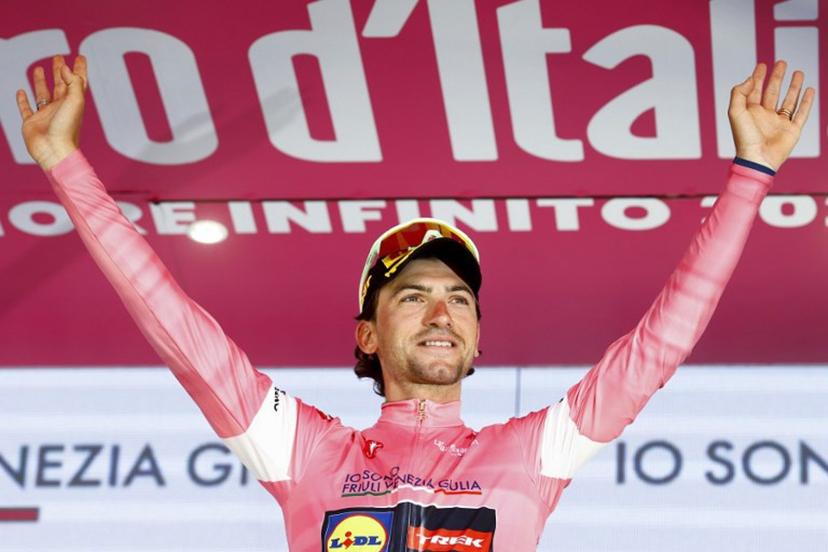 Lidl - Trek Italian rider Giulio Ciccone wearing the overall leader's pink jersey (Maglia Rosa) reacts on the podium after the 4th stage of the Giro d'Italia 2026 - Tour of Italy cycling race between Catanzaro and Cosenza, Italy, on May 12, 2026.  Luca Bettini / AFP