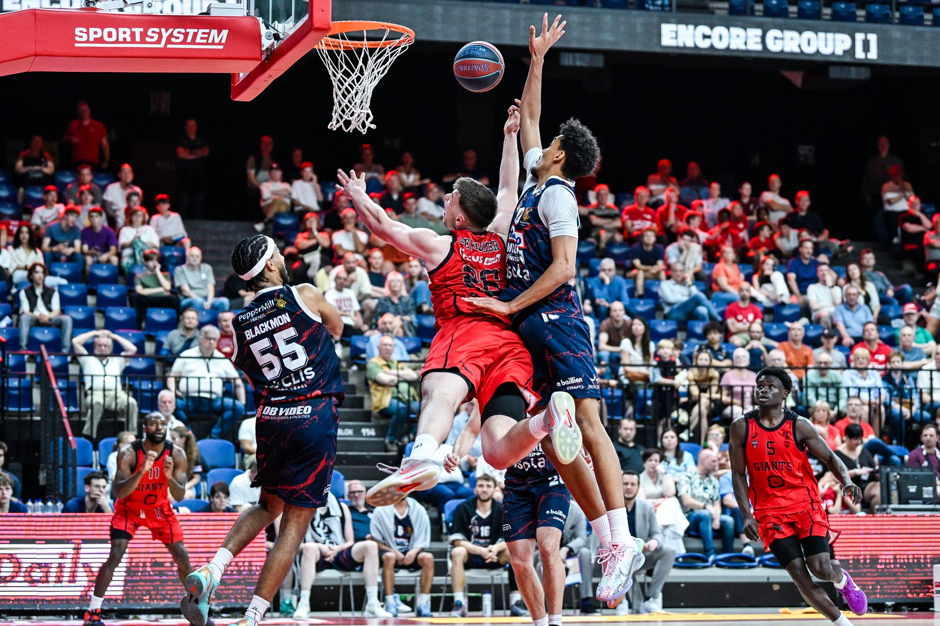 Limburg's Jalen Blackmon, Antwerp's Niels De Ridder and Limburg's Aubin Gateretse pictured in action during a basketball match between Antwerp Giants and Limburg United, Friday 22 May 2026, in Antwerp, on the first round (out of 5) of the Semi Finals Playoffs of the 'BNXT League' Belgian/ Dutch first division basket championship. BELGA PHOTO TOM GOYVAERTS