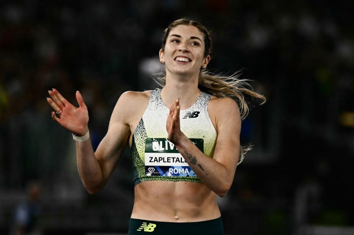 Slovakia's Emma Zapletalova celebrates after winning in the women's 400m Hurdles during the IAAF Diamond League athletics meeting, at the Olympic Stadium, in Rome on June 4, 2026.  Filippo MONTEFORTE / AFP