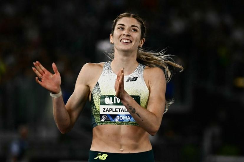Slovakia's Emma Zapletalova celebrates after winning in the women's 400m Hurdles during the IAAF Diamond League athletics meeting, at the Olympic Stadium, in Rome on June 4, 2026.  Filippo MONTEFORTE / AFP