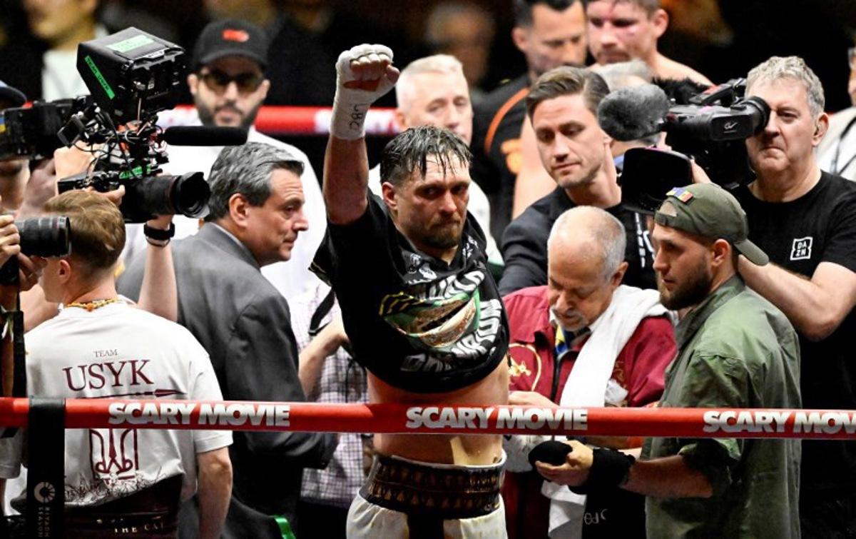 Ukraine's Oleksandr Usyk reacts after defeating Netherlands' Rico Verhoeven (off frame) by TKO during their WBC World Heavyweight Championship 'Glory in Giza' boxing match at the Pyramids of Giza on May 23, 2026. Heavyweight boxing king Oleksandr Usyk retained his titles after a dramatic and controversial stoppage victory over kick-boxer Rico Verhoeven with a second left of the 11th round in Egypt on May 23. Khaled DESOUKI / AFP