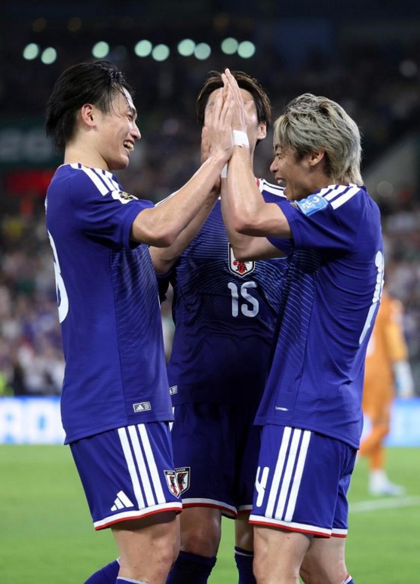 Japan's midfielder #14 Junya Ito (R) celebrates with Japan's forward #18 Ayase Ueda and Japan's midfielder #15 Daichi Kamada after scoring his team third goal during the 2026 World Cup Group F football match between Tunisia and Japan at the Monterrey Stadium in Guadalupe, Mexico, on June 20, 2026.   Julio Cesar AGUILAR / AFP